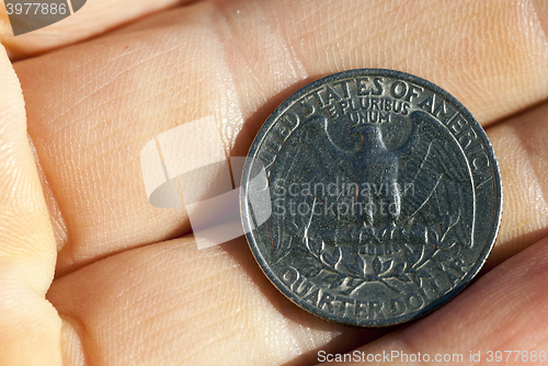 Image of coin in hand  