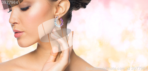 Image of close up of beautiful woman face with earring