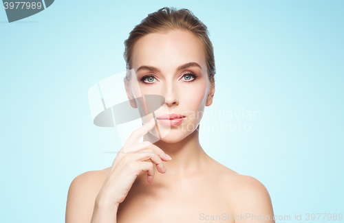 Image of beautiful young woman showing her lips