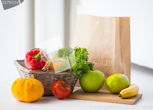 Image of basket of fresh friuts and vegetables at kitchen