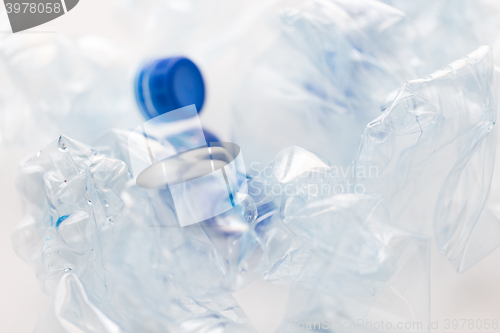 Image of close up of empty used plastic bottles on table