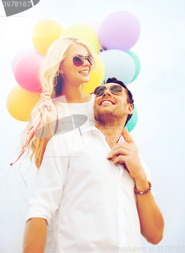 Image of couple with colorful balloons