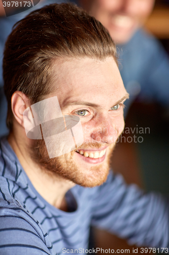 Image of happy smiling young man face