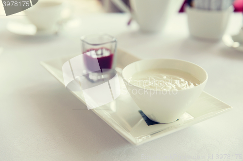 Image of close up of yogurt and jam at restaurant