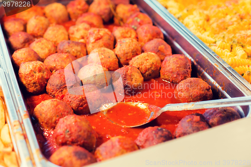 Image of close up of meatballs and other dishes on tray