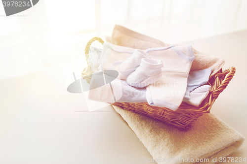 Image of close up of baby clothes for newborn boy in basket