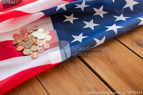 Image of close up of american flag and money on wood