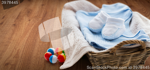 Image of close up of baby clothes for newborn boy in basket