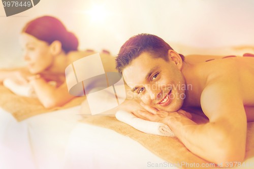 Image of couple in spa with hot stones