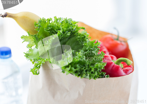Image of close up of bag with friuts, vegetables and water