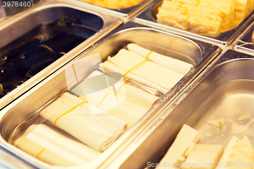 Image of spring rolls and snacks at street market