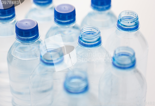 Image of close up of bottles with drinking water on table