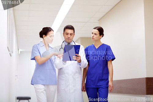 Image of group of medics at hospital with clipboard