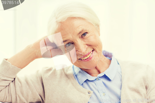 Image of happy senior woman face at home