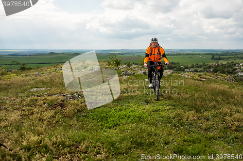 Image of Young man is riding bicycle outside. Healthy Lifestyle.