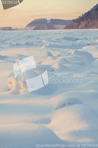 Image of landscape. weather, snowdrifts in the foreground