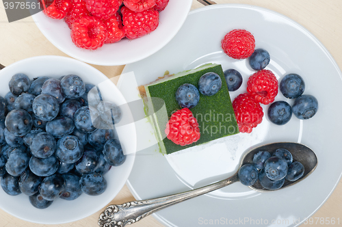 Image of green tea matcha mousse cake with berries