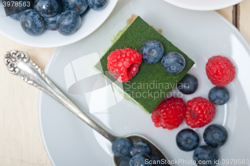 Image of green tea matcha mousse cake with berries
