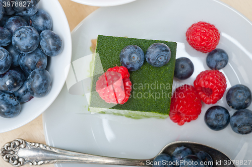 Image of green tea matcha mousse cake with berries