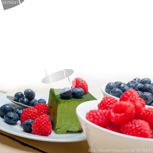 Image of green tea matcha mousse cake with berries