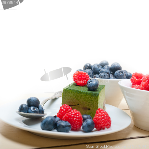 Image of green tea matcha mousse cake with berries