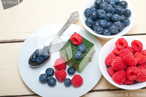 Image of green tea matcha mousse cake with berries