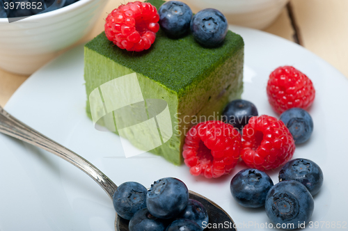 Image of green tea matcha mousse cake with berries