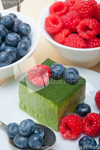 Image of green tea matcha mousse cake with berries