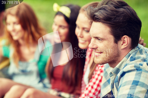 Image of group of smiling friends outdoors