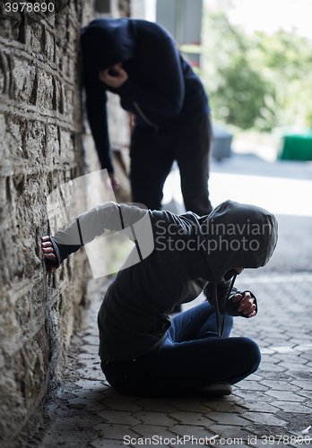 Image of close up of addicts and drug syringes