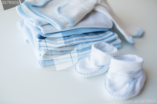 Image of close up of baby boys clothes for newborn on table