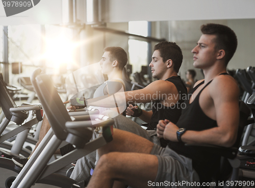 Image of men working out on exercise bike in gym