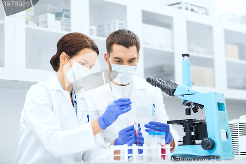 Image of young scientists making test or research in lab