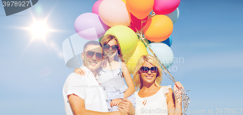 Image of family with colorful balloons