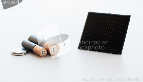 Image of close up of alkaline batteries and solar cell