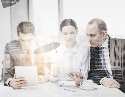 Image of business team with tablet pc having discussion