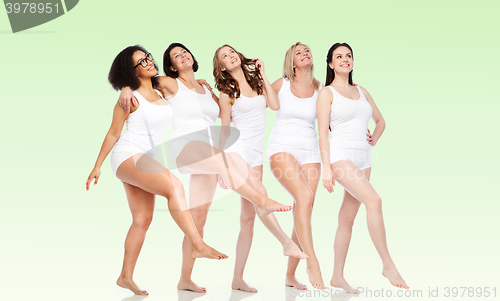 Image of group of happy different women in white underwear