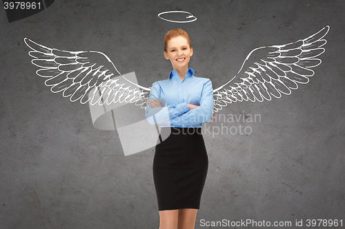 Image of happy businesswoman with angel wings and nimbus