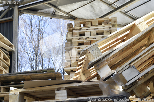 Image of Waste wood from pallets stacked in the storage room