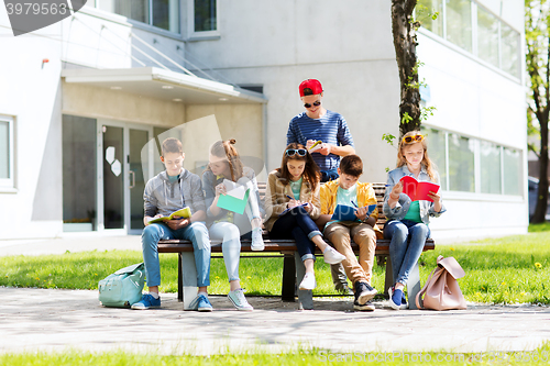 Image of group of students with notebooks at school yard