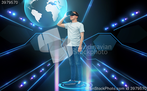 Image of happy man in virtual reality headset or 3d glasses