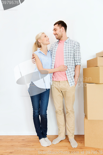 Image of couple with cardboard boxes moving to new home