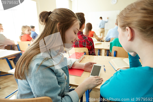 Image of student girls with smartphone at school