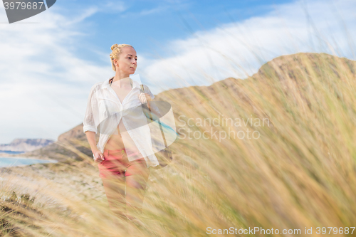 Image of Free Happy Woman Enjoying Sun on Vacations.