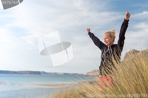 Image of Free Happy Woman Enjoying Sun on Vacations.