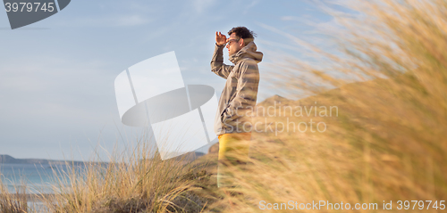 Image of Free active man enjoying beauty of nature.