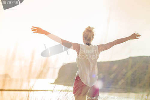 Image of Free Happy Woman Enjoying Sun on Vacations.