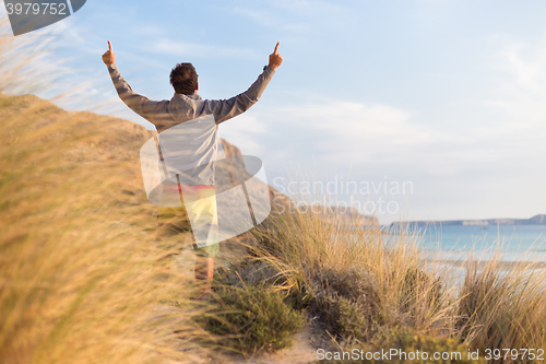 Image of Free active man enjoying beauty of nature.