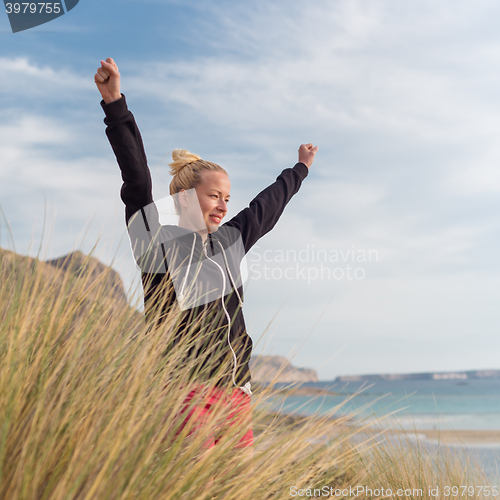 Image of Free Happy Woman Enjoying Sun on Vacations.