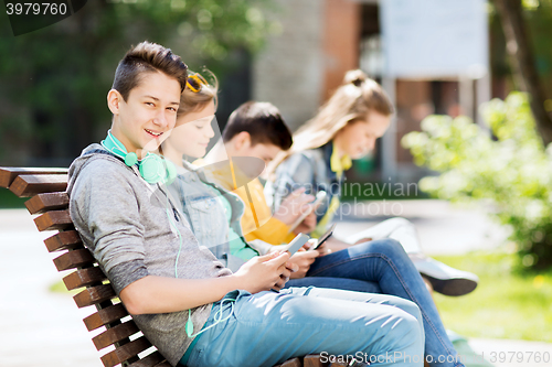 Image of happy teenage boy with tablet pc and headphones